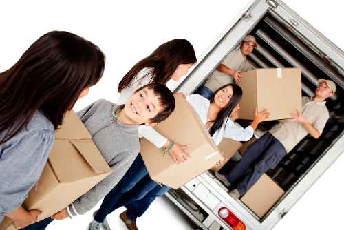 Storage facility workers reviewing ethical sourcing documents