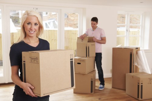 Small removals team loading furniture in Westealing