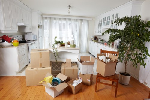 Packed moving boxes ready for house removals in Westealing